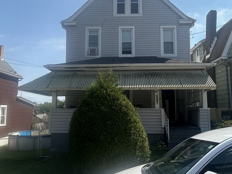 Before renovation: front of the house with tired siding, house on 3316 Stewart St, McKeesport PA