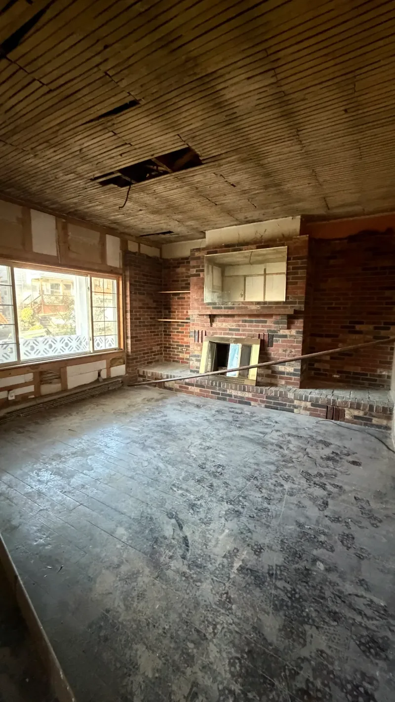 Before renovation: living room at 406 35th St, McKeesport