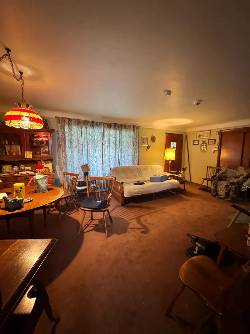 Before renovation: living room at 498 Taylor St, North Versailles