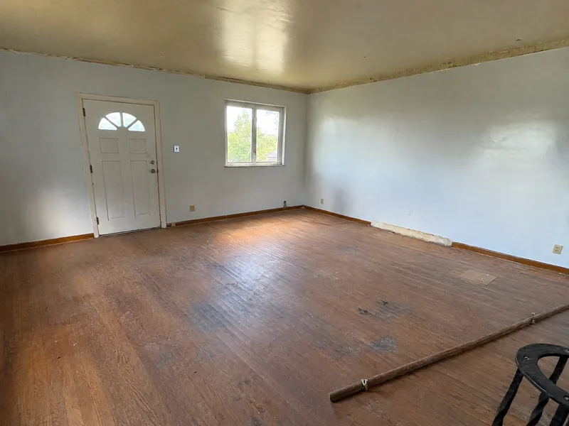 Before renovation: living room at 5824 Holsing St, Elizabeth