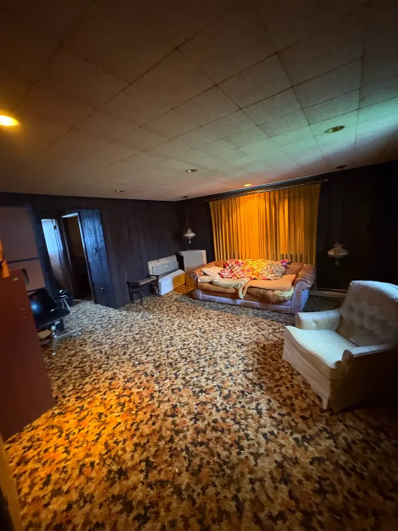 Before renovation: family room at 704 Heath St, Elizabeth