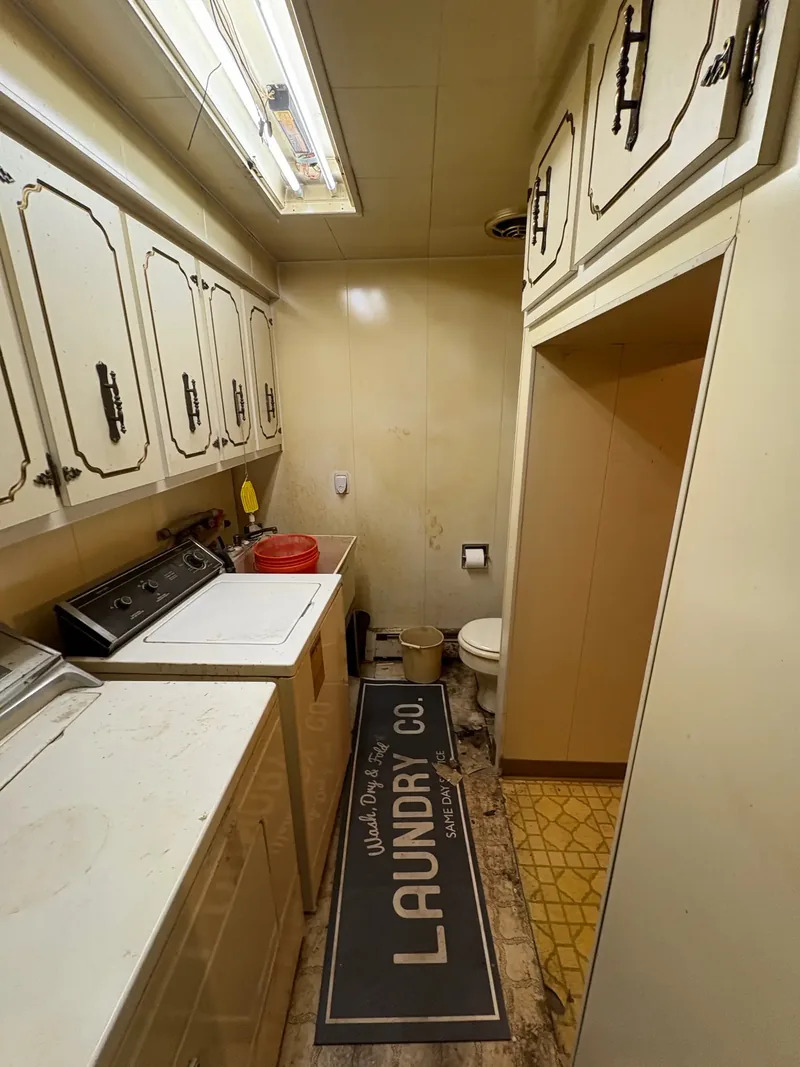 Before renovation: laundry half bath at 704 Heath St, Elizabeth