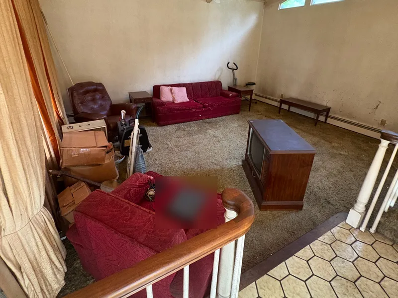 Before renovation: living room at 704 Heath St, Elizabeth
