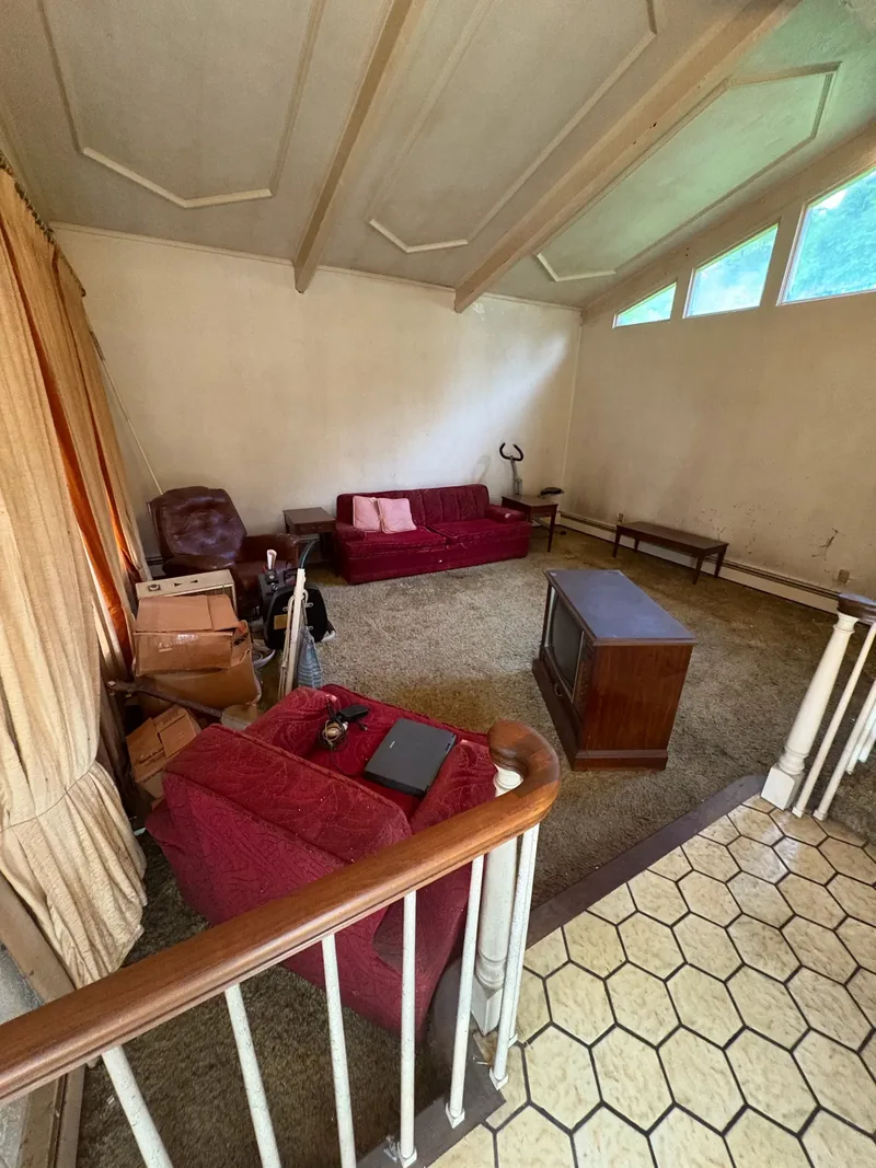 Before renovation: living room at 704 Heath St, Elizabeth