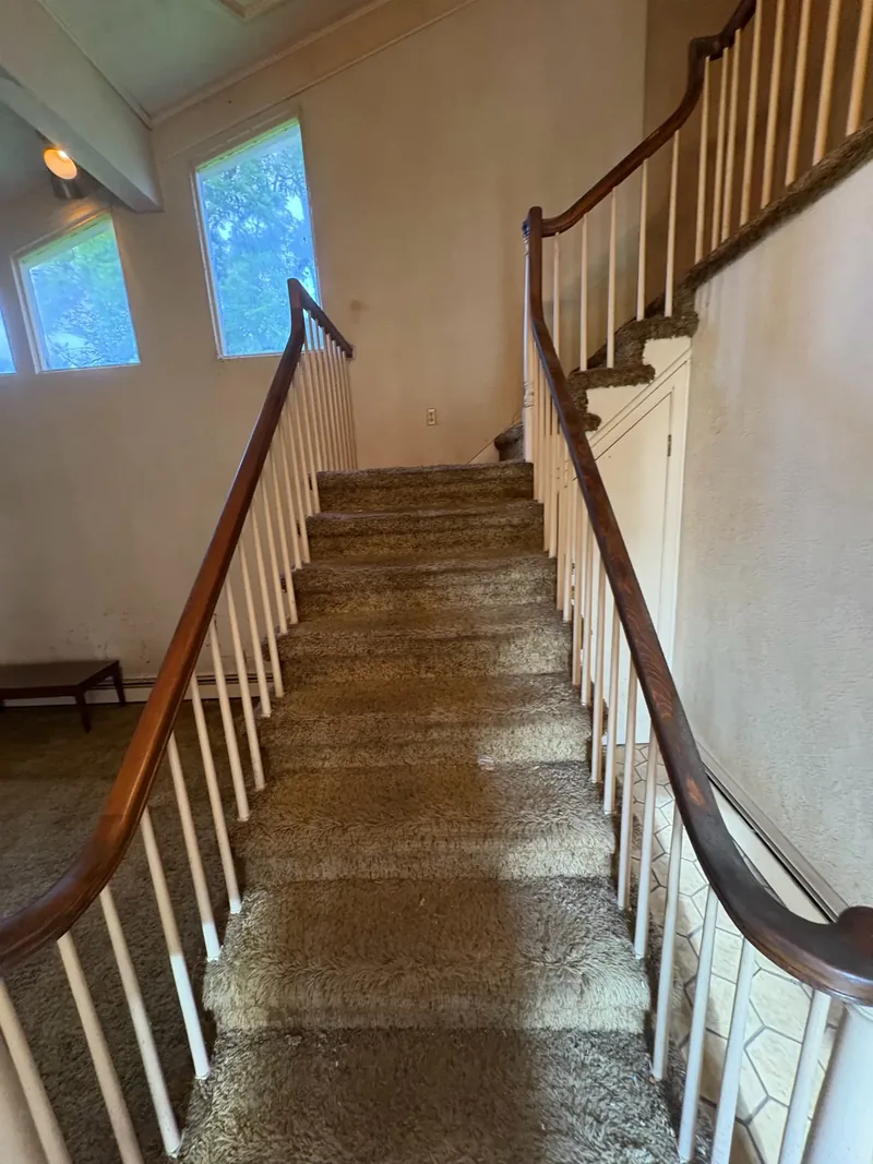 Before renovation: stairs at 704 Heath St, Elizabeth