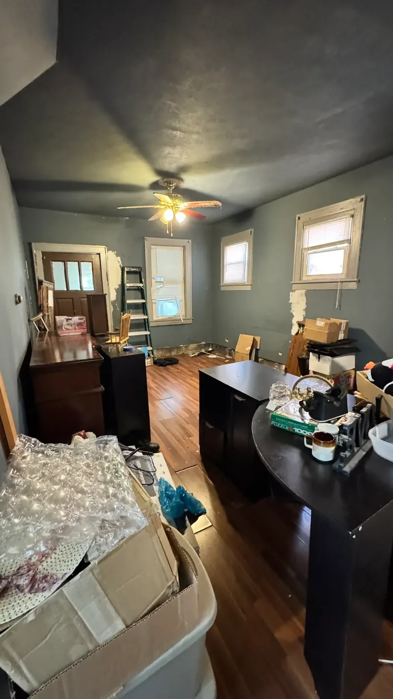 Before renovation: living room at 905 Rebecca St, Port Vue